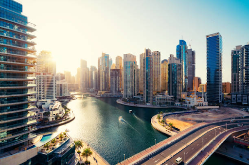 Aerial view of RAK Free Zone with modern buildings and winding waterway, highlighting its dynamic amenities.